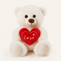 Peluche ourson blanche tenant un cœur rouge brodé Love, vue de face sur fond ivoire