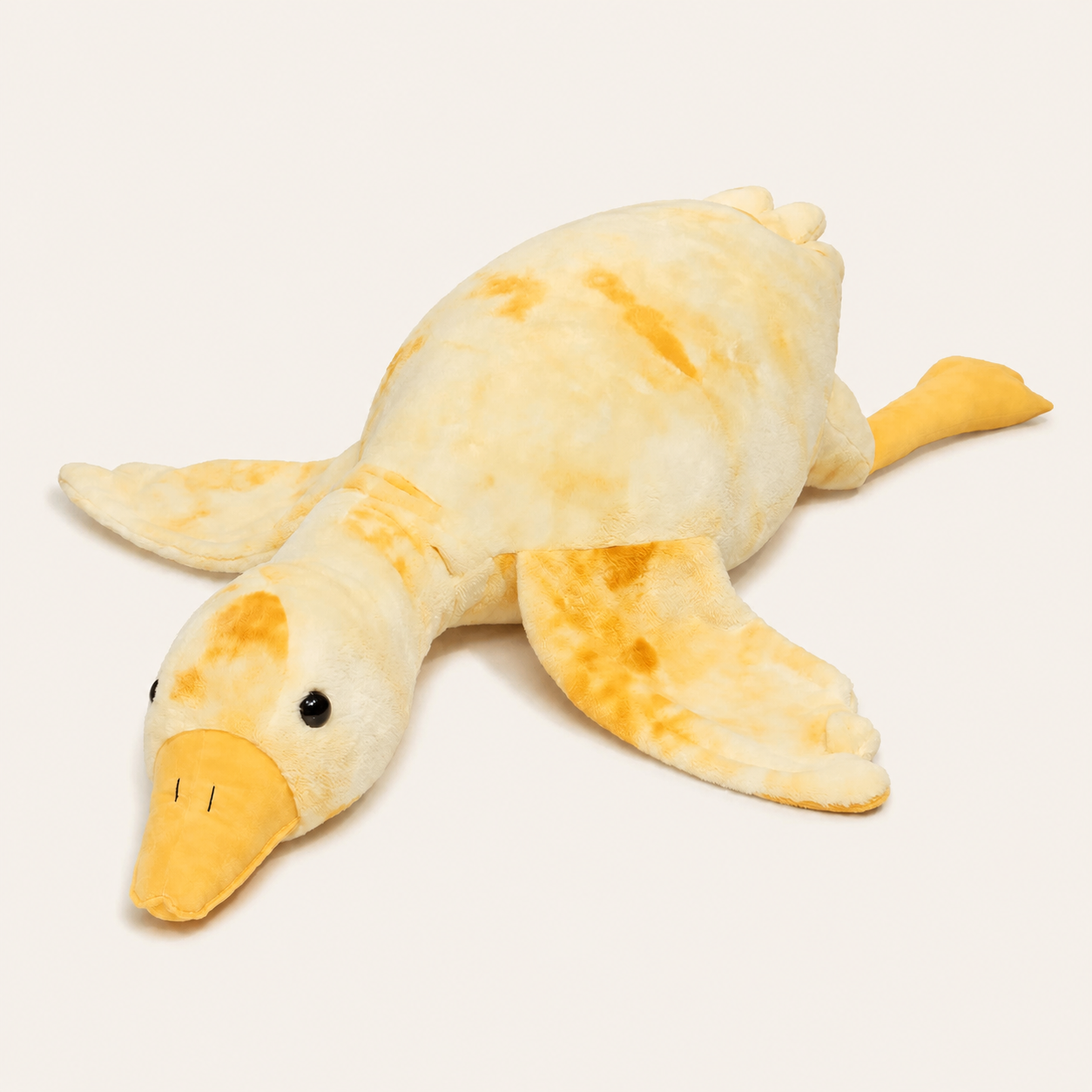 Grande peluche oie jaune vue de face et trois-quarts sur fond ivoire