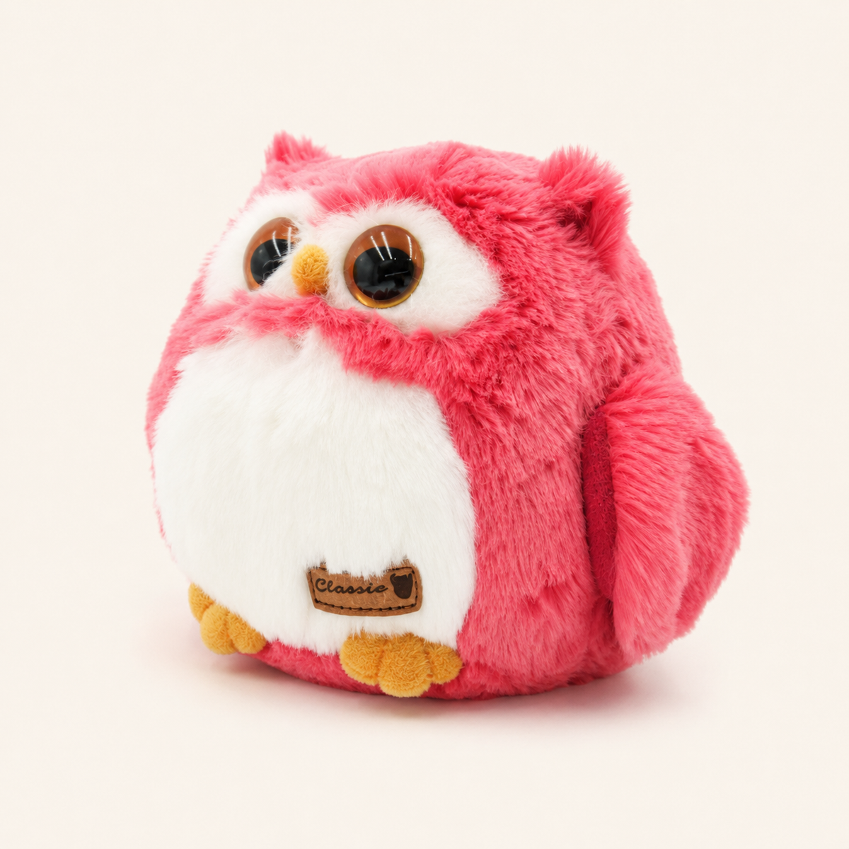 Peluche hibou rose de 11 cm vue latérale trois-quarts sur fond ivoire