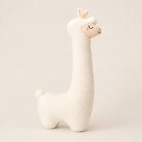 Grand alpaga en peluche blanc ivoire vu de profil trois-quarts