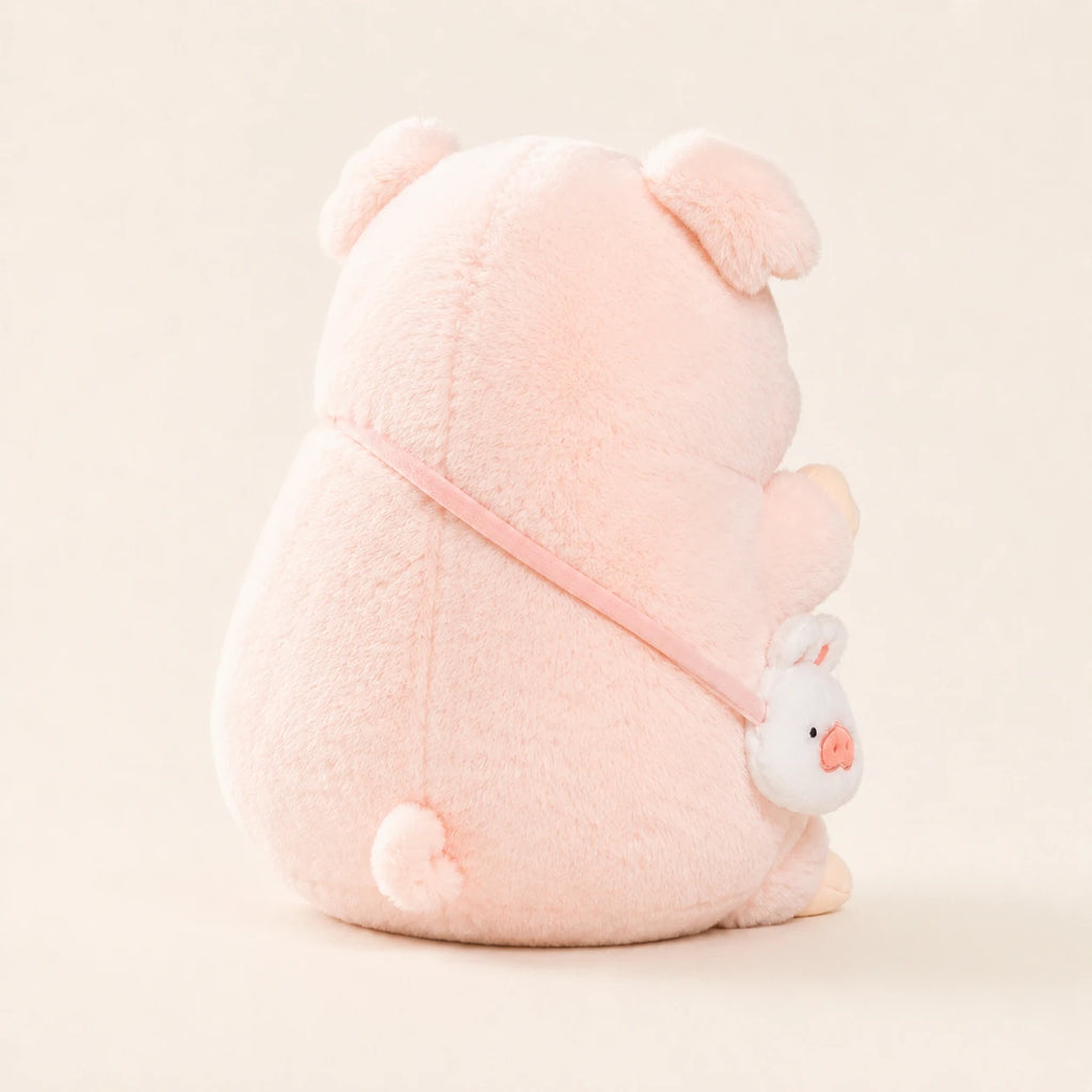 Peluche cochon rose vue de dos, fond ivoire