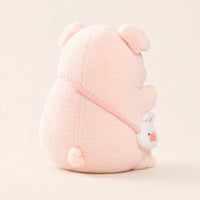 Peluche cochon rose vue de dos, fond ivoire