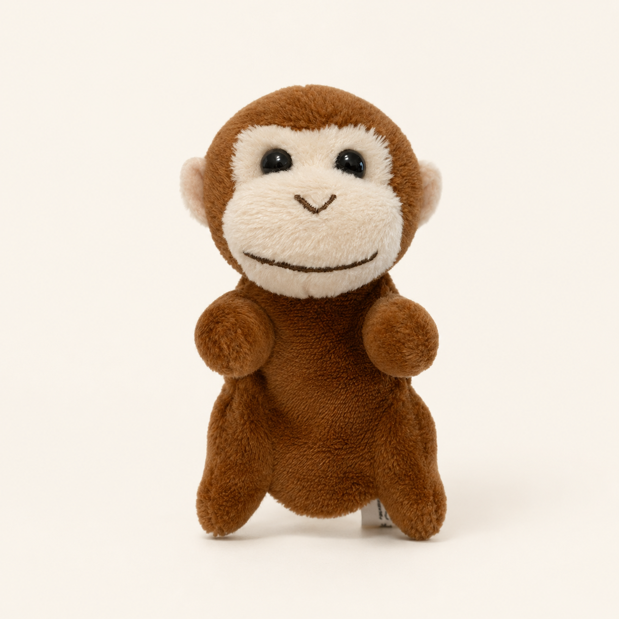Marionnette à doigt peluche singe sur fond ivoire - vue principale