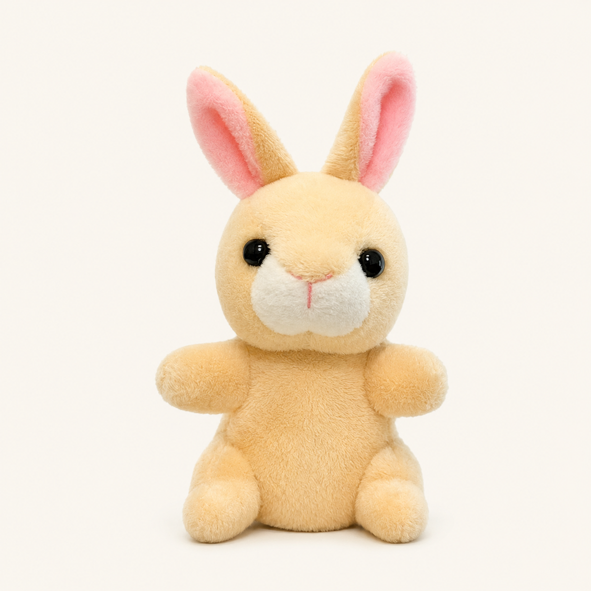 Marionnette à doigt peluche lapin beige, vue de face, environ 9 cm