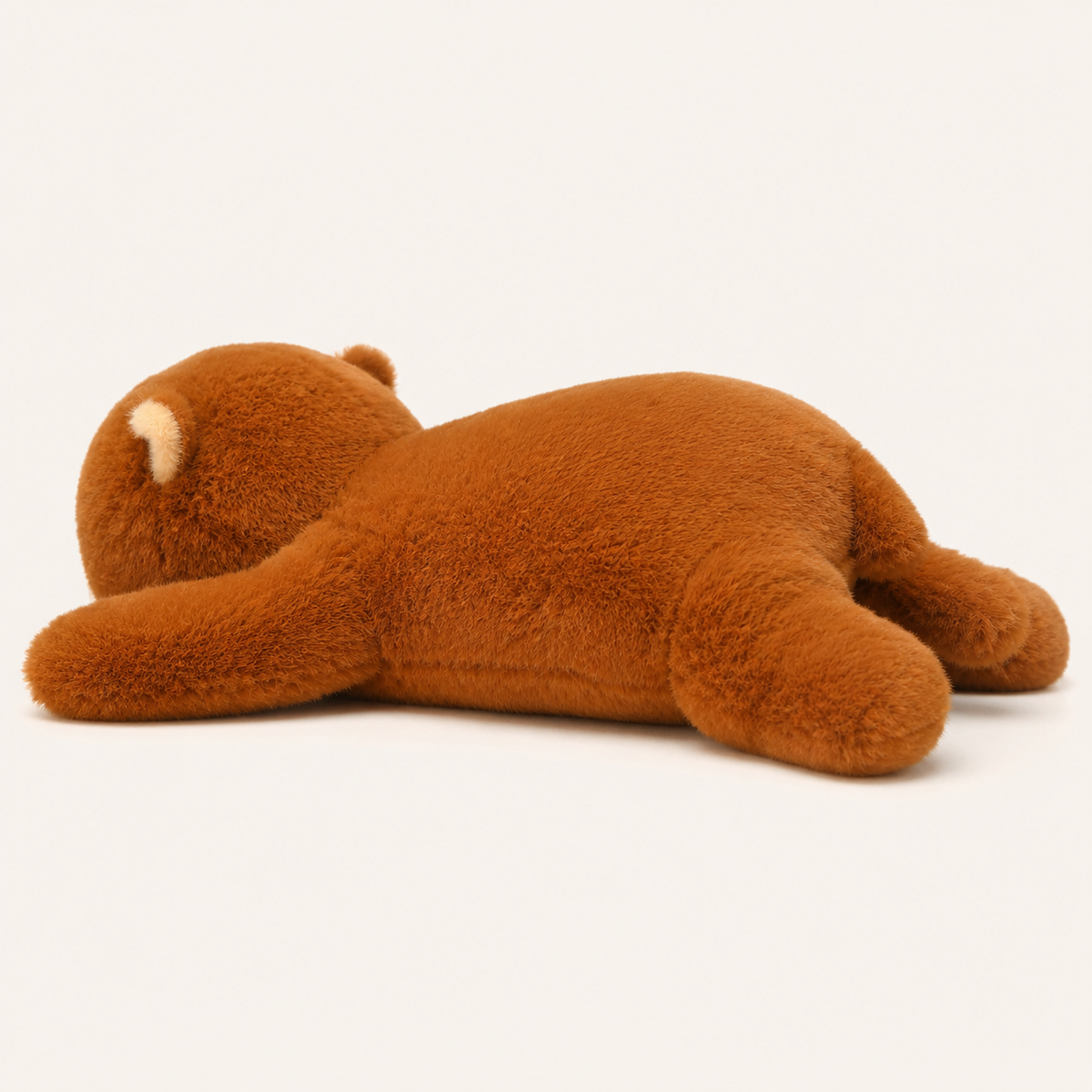Coussin peluche ours brun couché, autre angle - Royaume Peluche
