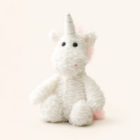 Peluche licorne blanche à longues pattes, vue de face sur fond ivoire