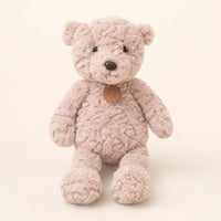 Peluche ours brun clair à longues pattes, vue de face sur fond ivoire
