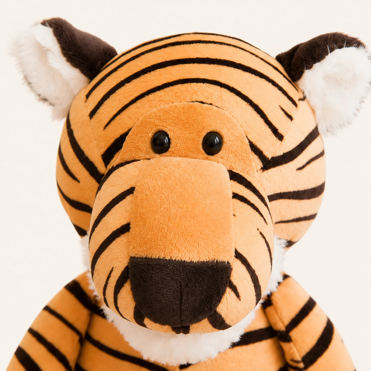 Gros plan du visage de la peluche tigre rayé