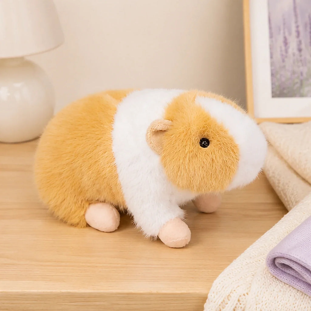 Peluche cochon d'Inde jaune blanc en situation