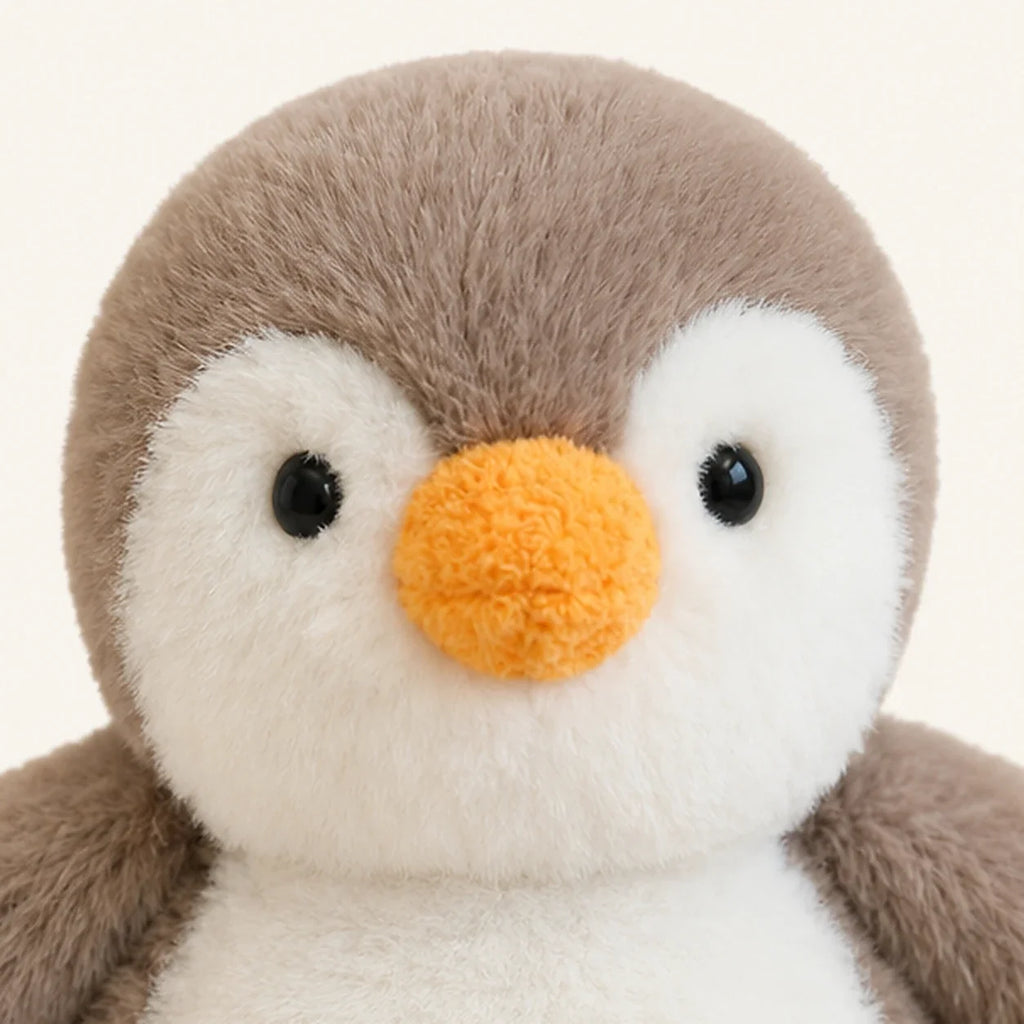 Peluche pingouin 20-23 cm - détail visage