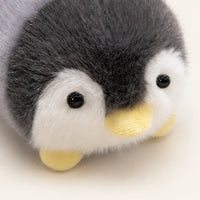 Peluche pingouin allongee 16 cm - détail visage