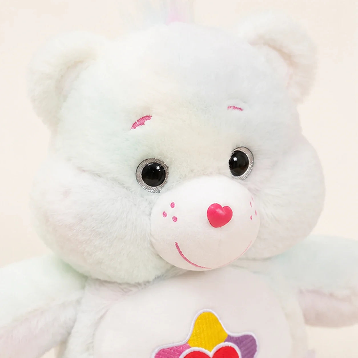 Peluche ours tie-dye 33 cm - détail visage