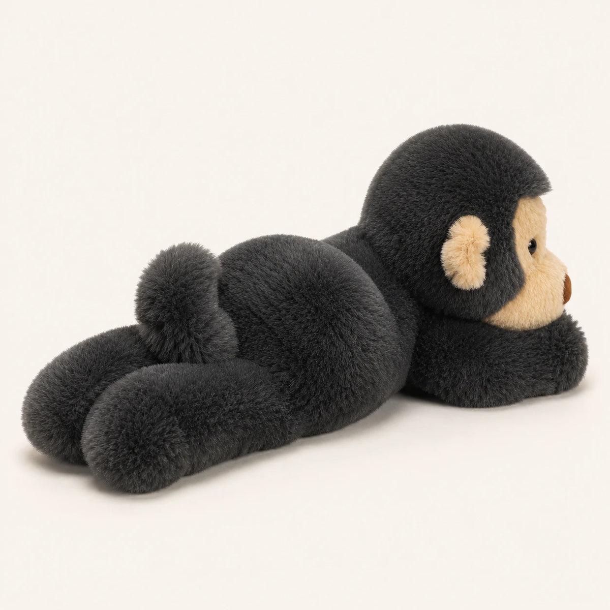 Peluche singe noire vue de dos et de profil sur fond ivoire