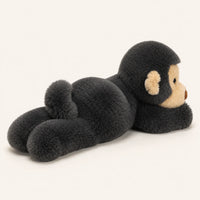 Peluche singe noire vue de dos et de profil sur fond ivoire