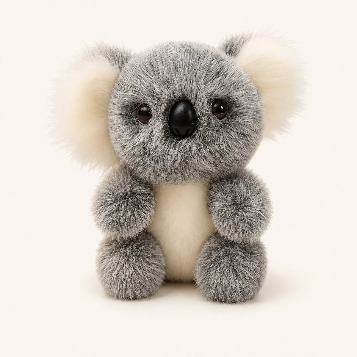 Peluche koala gris et blanc, vue de face, fond ivoire