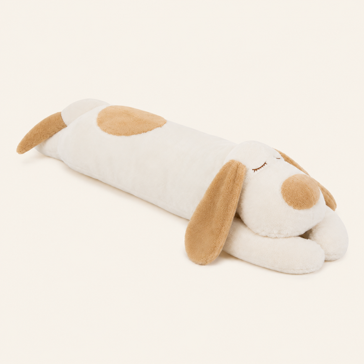 Peluche chien allongé, autre angle, fond ivoire