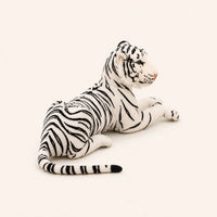 Peluche tigre blanc vue de trois-quarts, fond ivoire