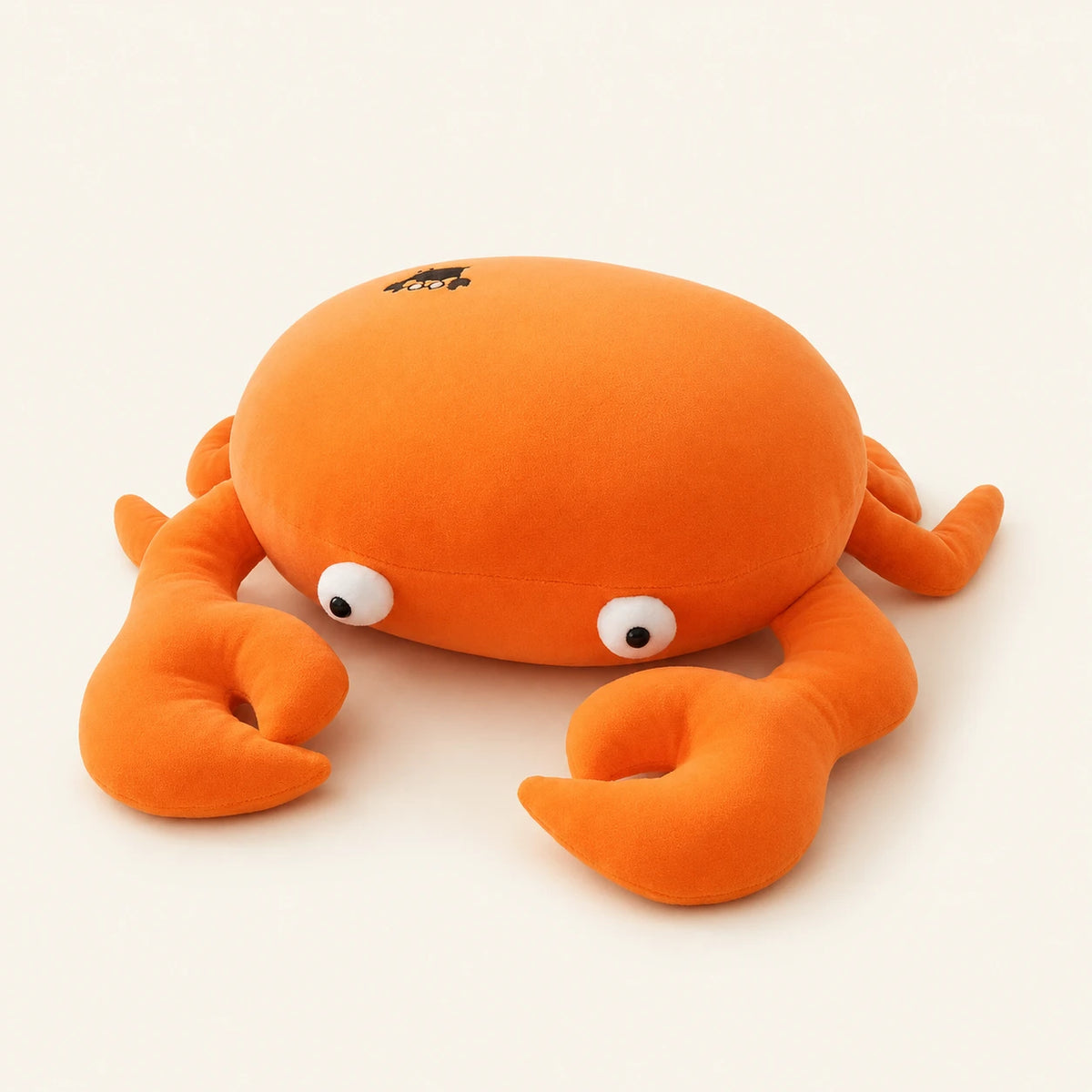 Coussin peluche crabe orange