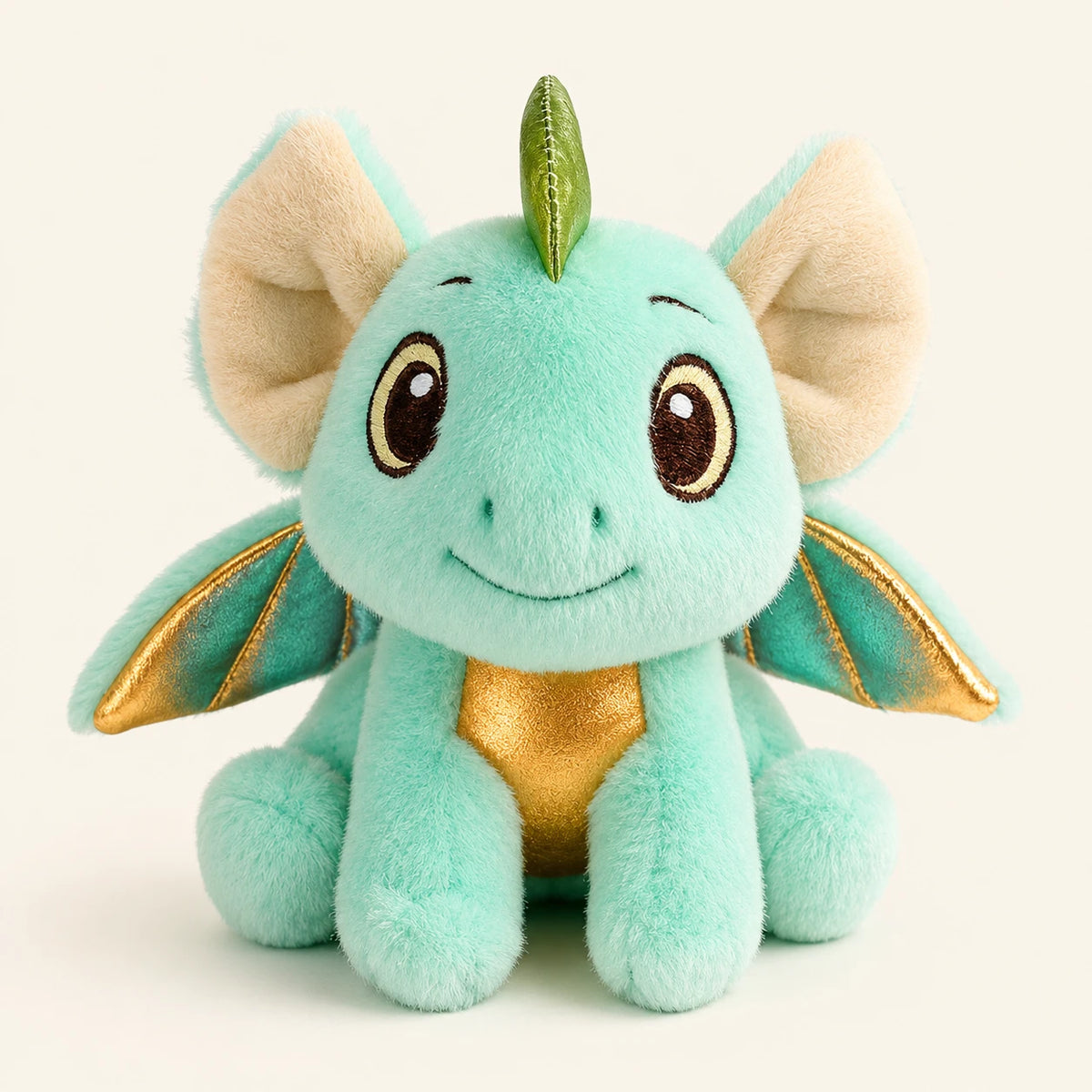 Peluche magnétique d'épaule dragon vert menthe, vue de face sur fond ivoire