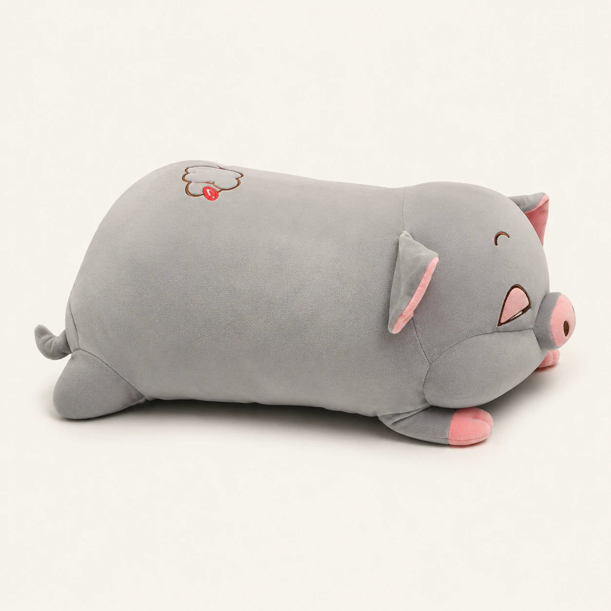 Peluche cochon dodu gris, vue de profil sur fond ivoire
