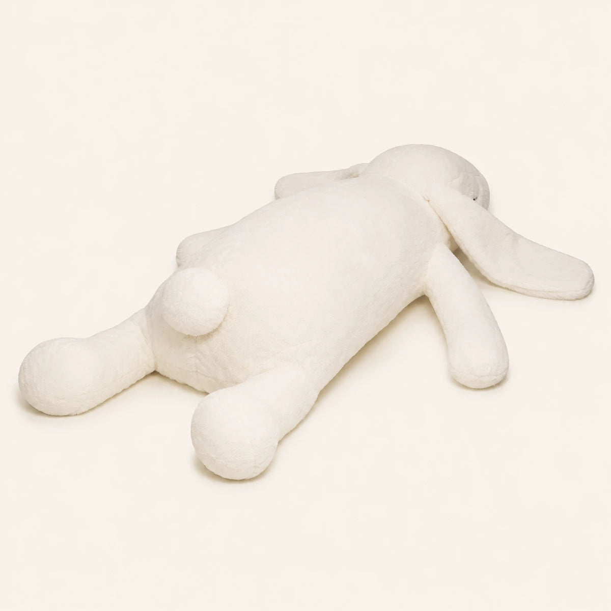 Peluche lapin géant blanc, autre angle sur fond ivoire