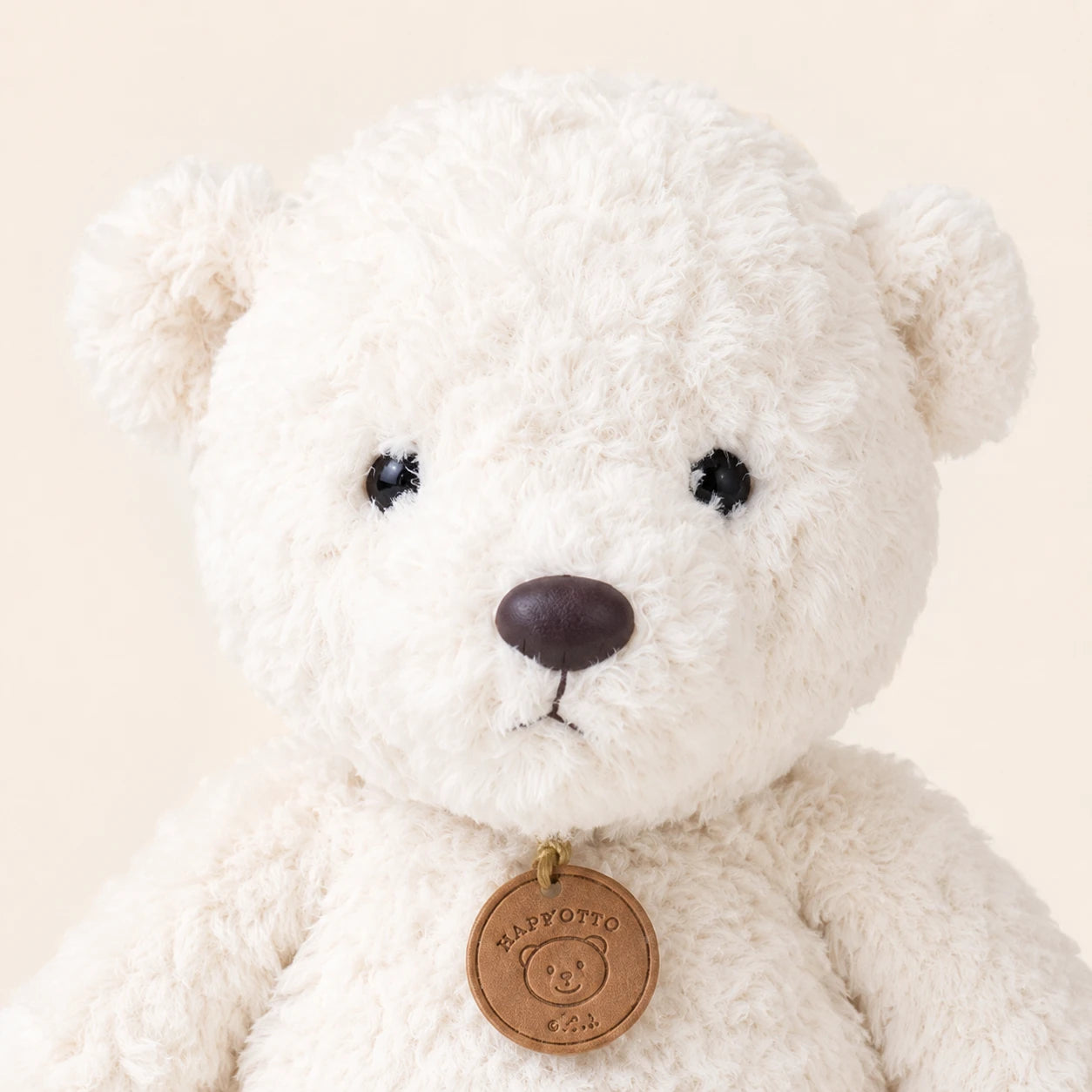 Peluche ours blanc longues pattes 35 cm, gros plan sur le visage