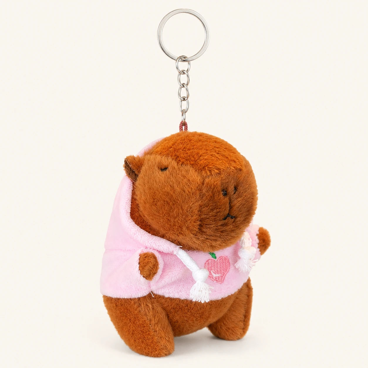 Peluche porte-clés capybara à capuche rose, vue de face