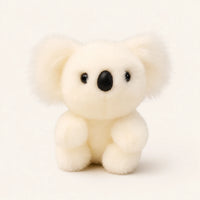 Peluche koala blanc, vue de face sur fond ivoire