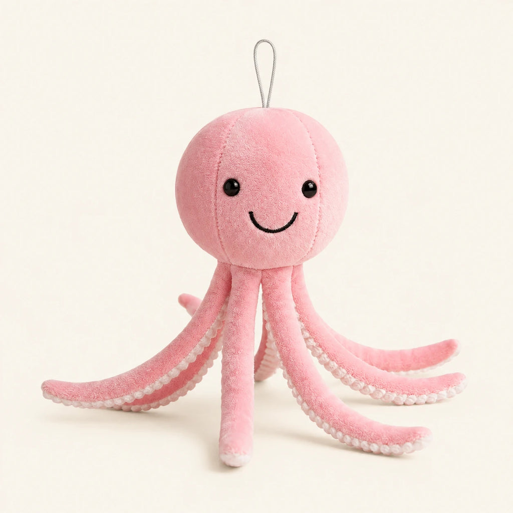 Peluche pieuvre rose, vue de face, fond ivoire