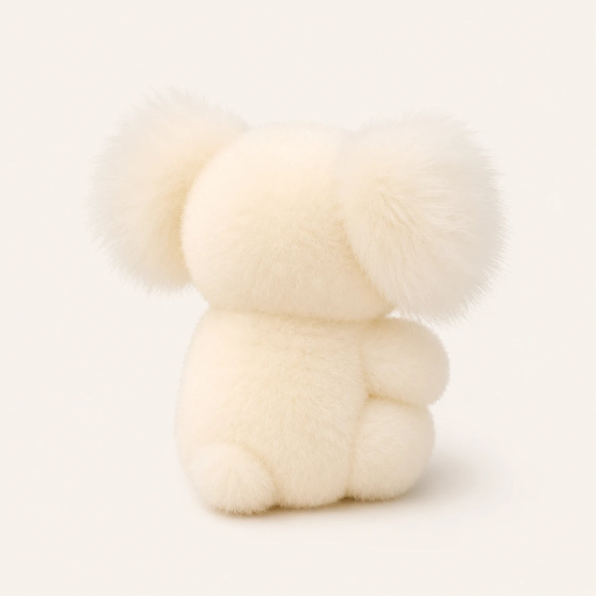 Peluche koala blanc vue de dos, montrant la fourrure duveteuse