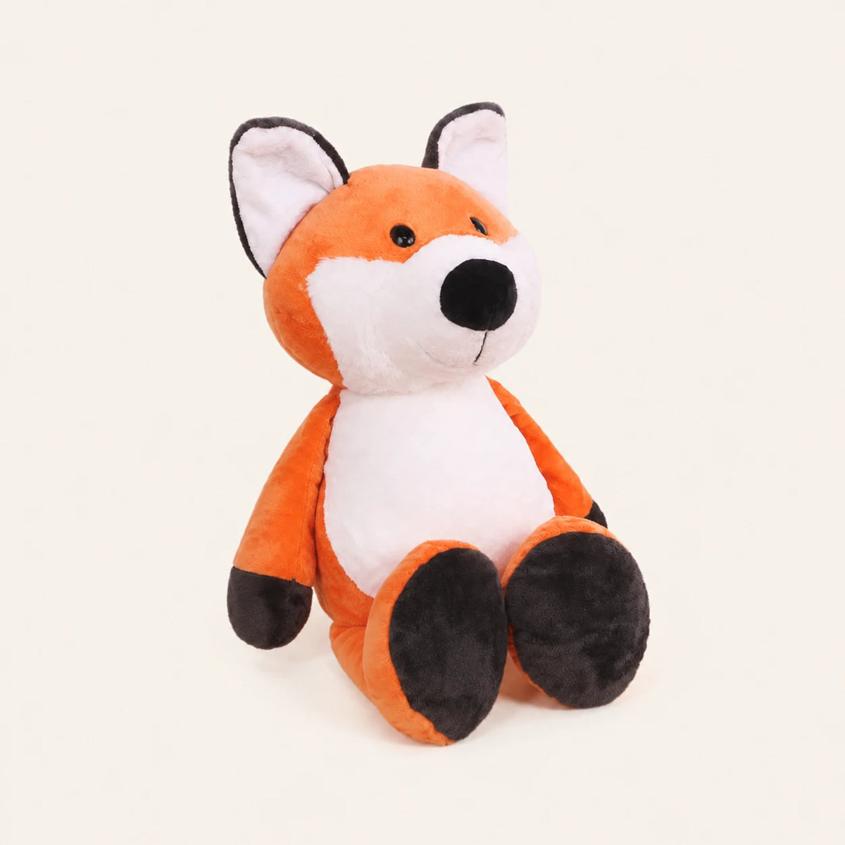 Peluche renard vue de trois-quarts sur fond ivoire