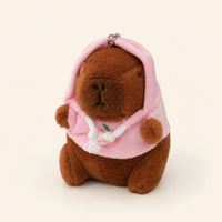 Peluche porte-cles capybara a capuche rose, vue principale sur fond ivoire