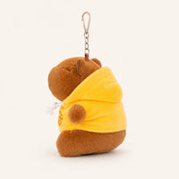 Peluche porte-clés capybara à capuche jaune, vue de dos