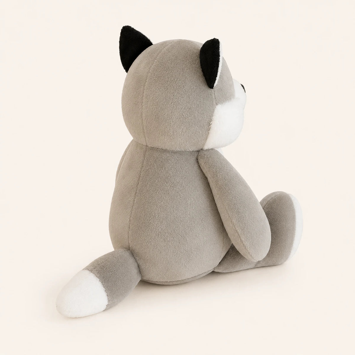 Peluche husky gris vue de dos trois-quarts, fond ivoire