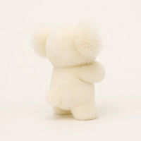 Peluche koala blanche, vue de dos, fond ivoire