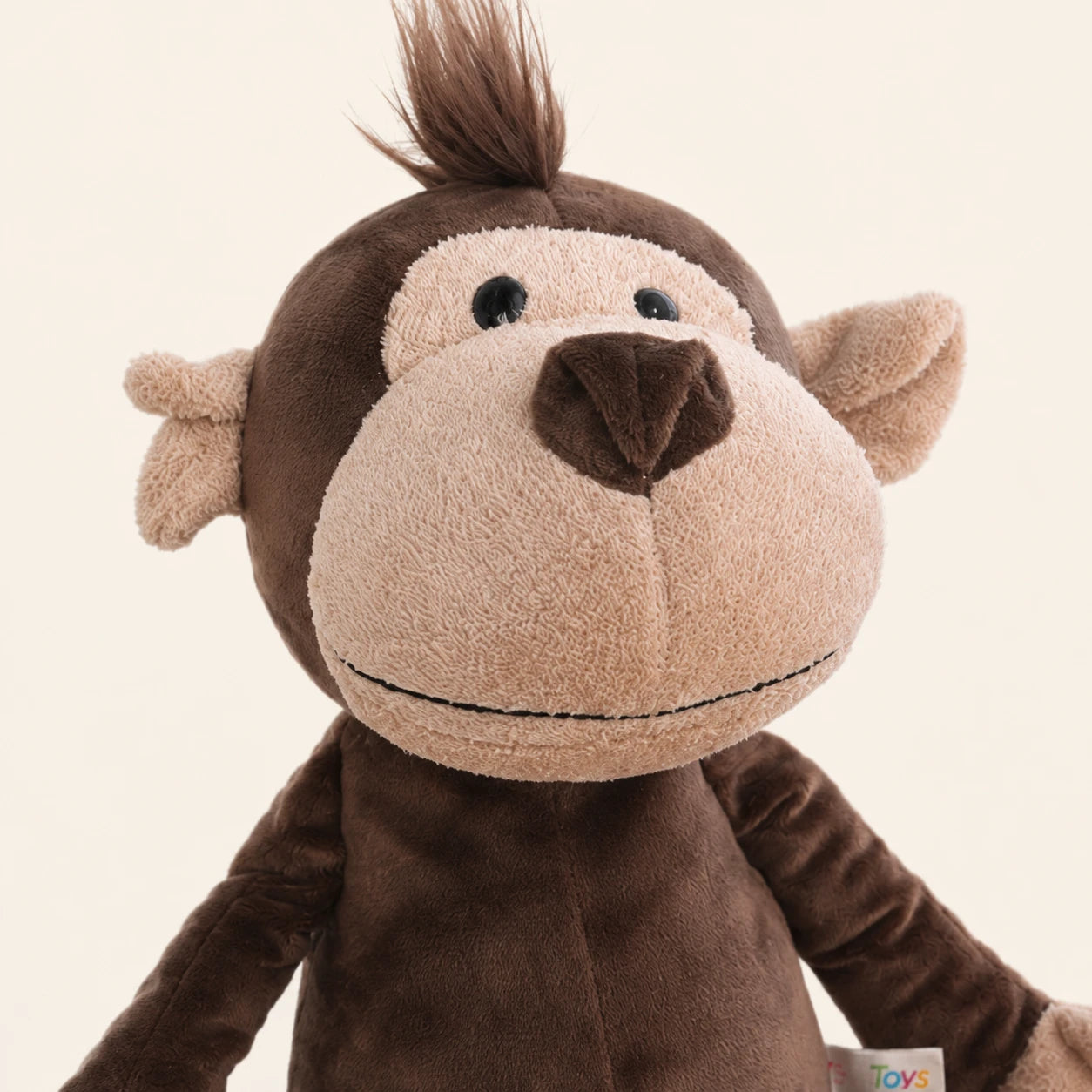 Gros plan sur le visage et la texture de la peluche singe