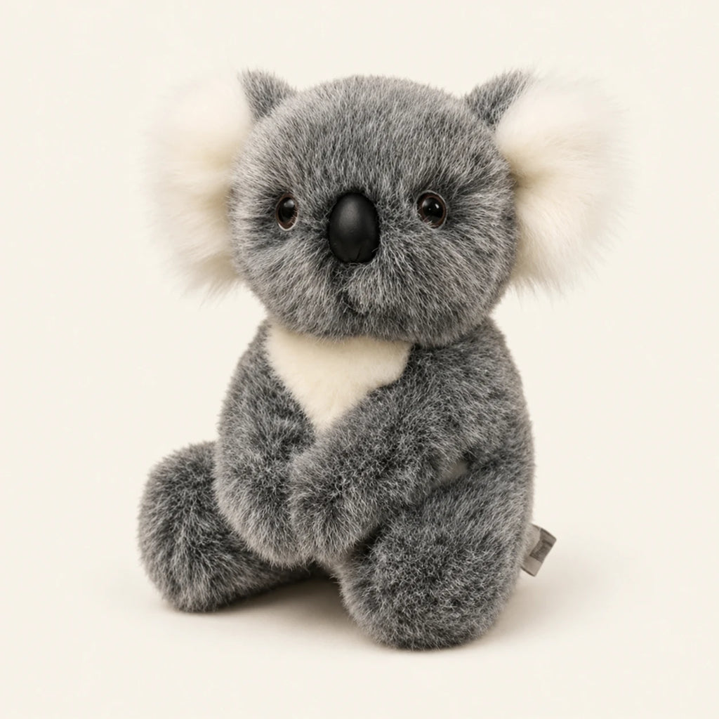 Peluche koala grise assise, vue principale sur fond ivoire