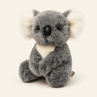 Peluche koala grise assise, vue principale sur fond ivoire