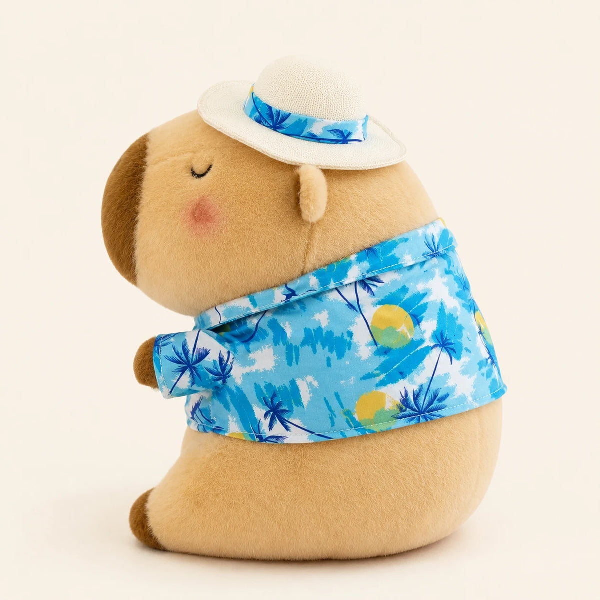 Peluche capybara marron avec chemise hawaienne, vue de profil