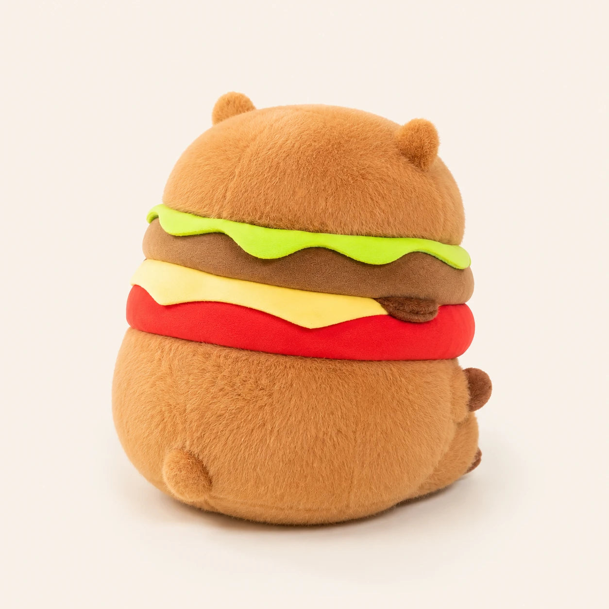 Peluche capybara hamburger, vue de dos, fond ivoire