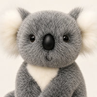 Gros plan sur le visage de la peluche koala grise