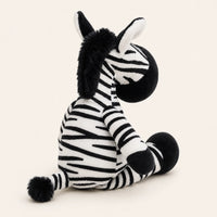 Peluche zèbre vue de dos, fond ivoire