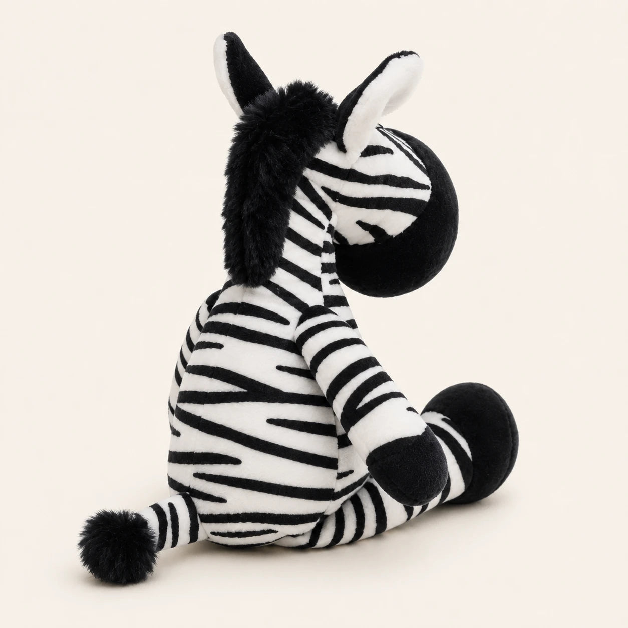 Peluche zèbre vue de dos, fond ivoire