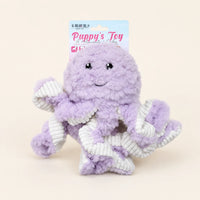 Jouet peluche pieuvre violette pour chien, fond ivoire