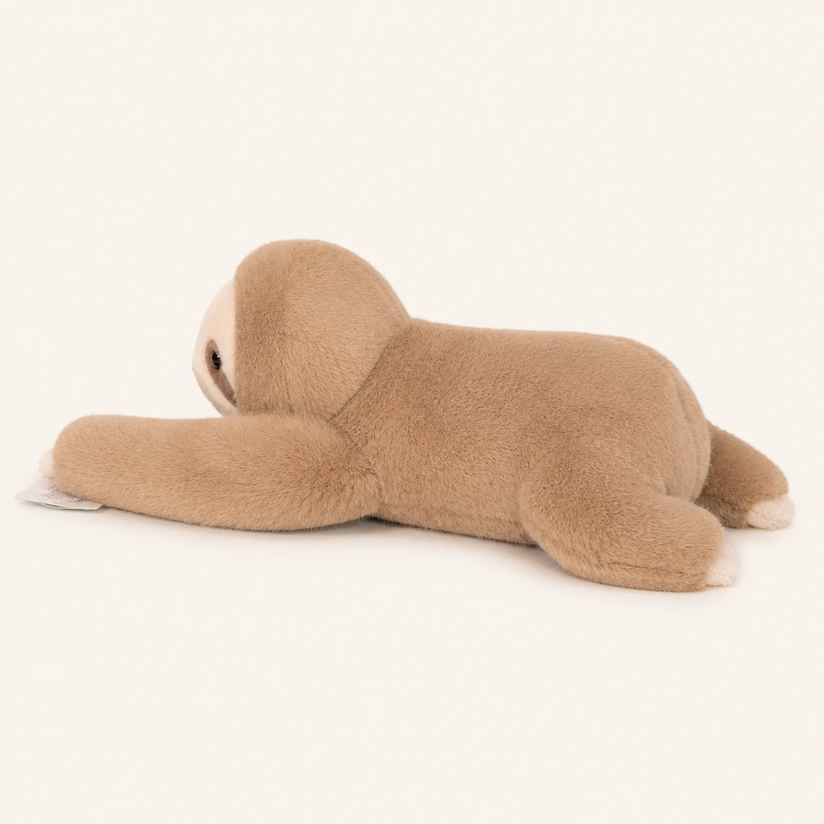 Peluche paresseux beige, vue de côté, fond ivoire