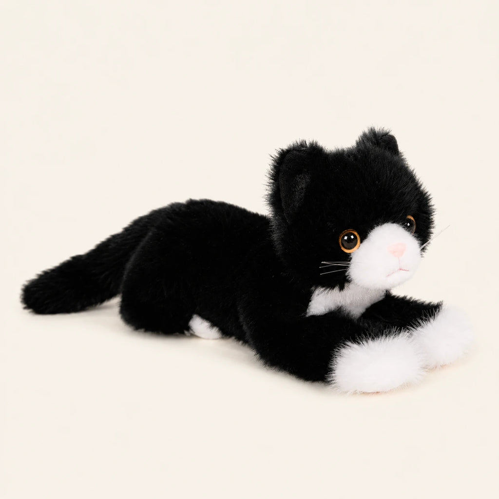 Peluche chat realiste noir et blanc, autre angle sur fond ivoire
