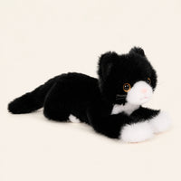 Peluche chat realiste noir et blanc, autre angle sur fond ivoire
