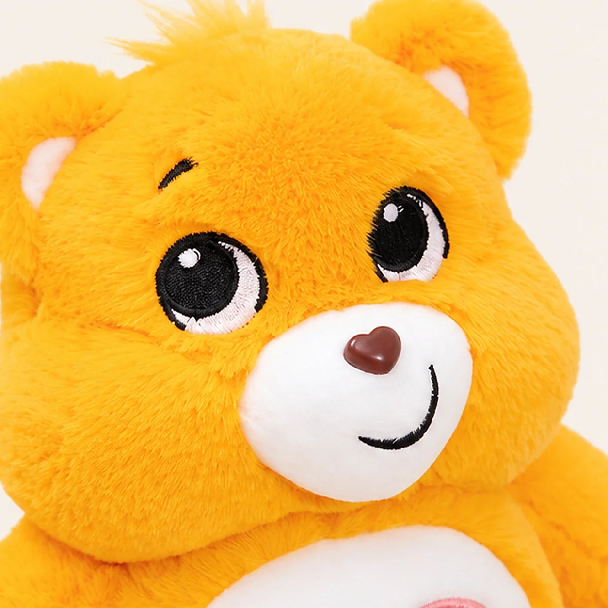 Peluche ours jaune 33 cm détail visage