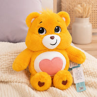 Peluche ours jaune 33 cm mise en situation