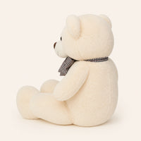 Grand ours en peluche blanc vue de profil